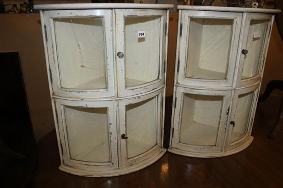 Pair painted bow front corner cabinets